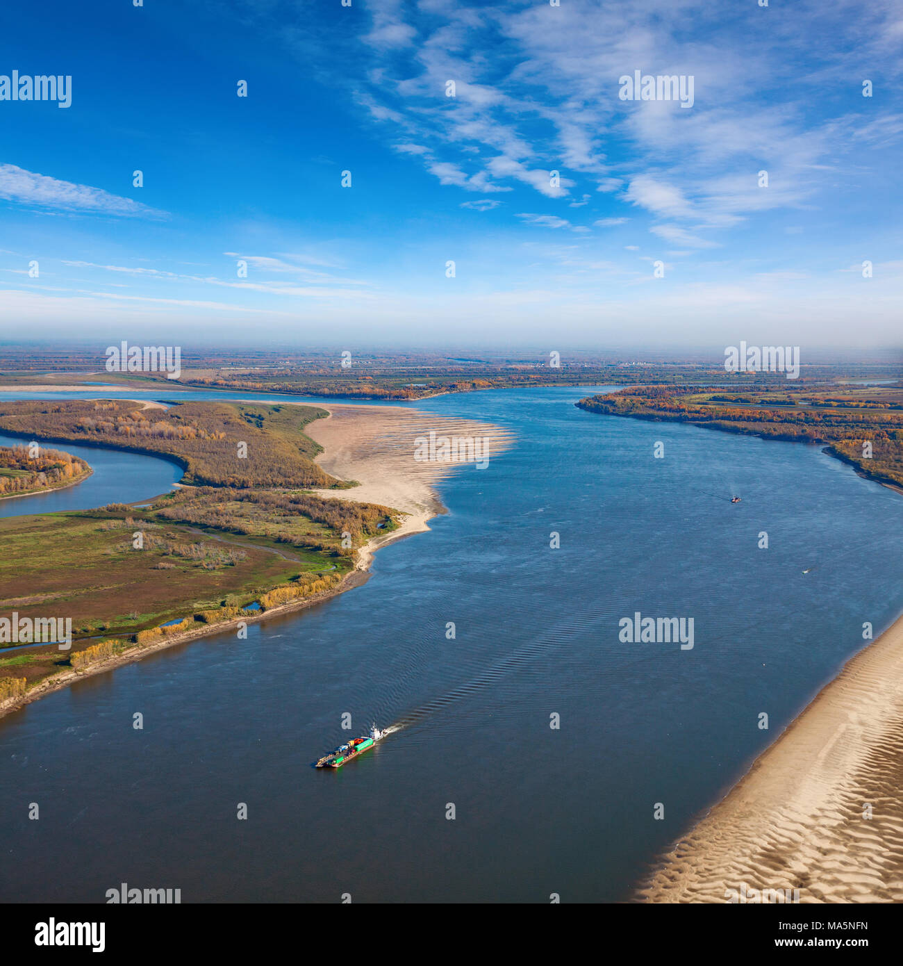 Tug ship with barge on the great river Stock Photo