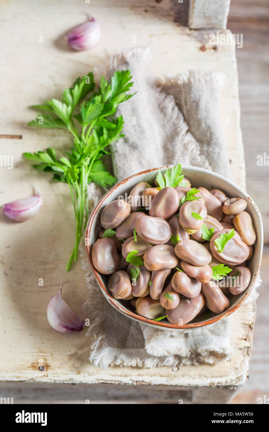 Fresh broad beans with garlic and parsley Stock Photo Alamy