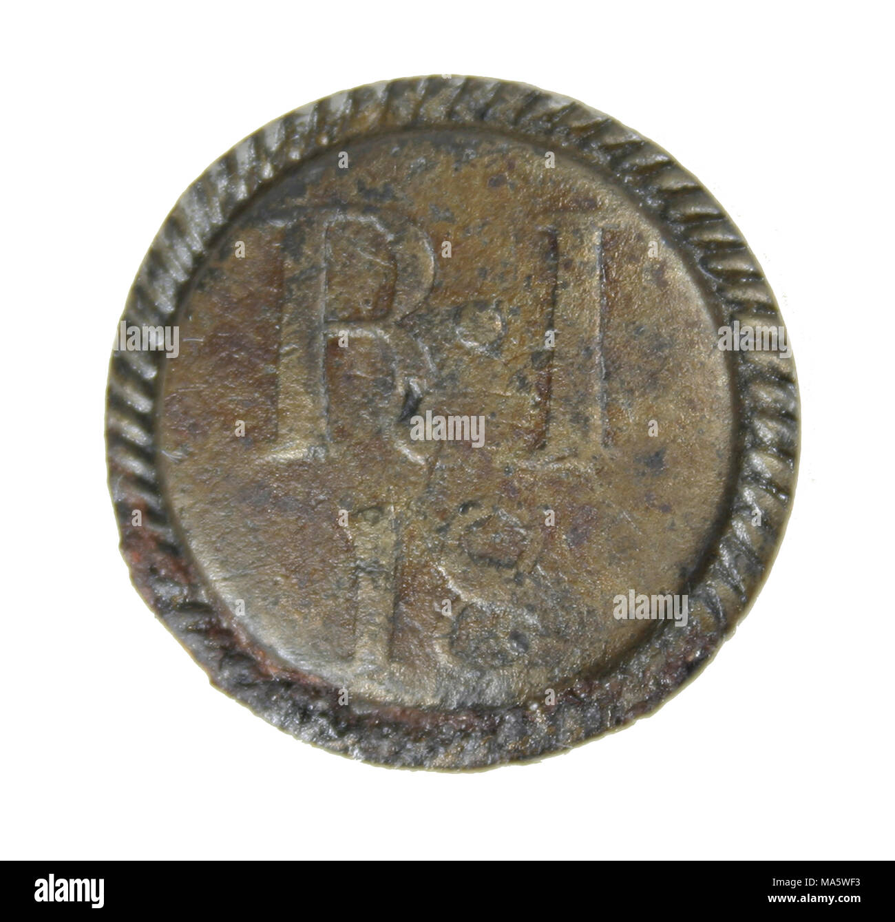 American Revolution. Pewter British soldier's button of the 18th Regiment of Foot (Royal Irish) which fought at Bunker Hill 1775 Stock Photo
