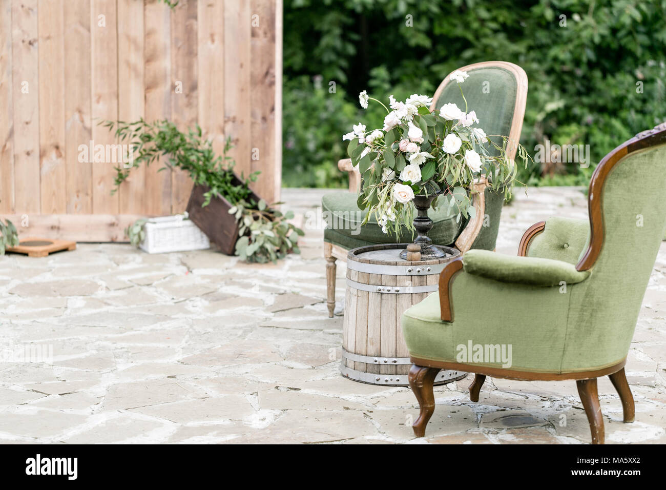 Vintage wood chairs and table with flower decoration in garden. outdoor  Stock Photo - Alamy