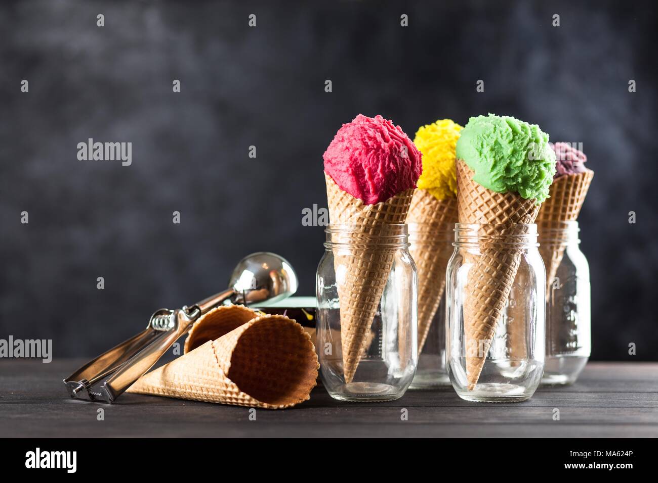 Ice cream cone on grey background Stock Photo - Alamy