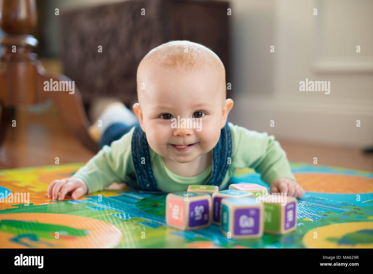 A six month old baby girl at play. Stock Photo