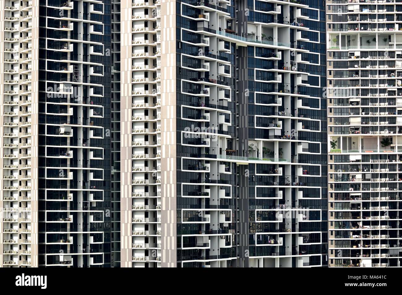 Front view of an enormous modern public housing apartment tower in Singapore with strong detail of design and architectural elements Stock Photo