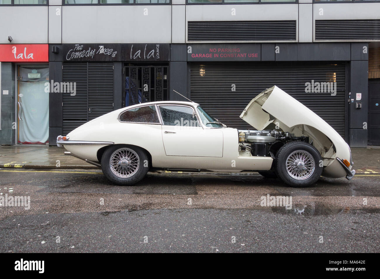 A broken down Jaguar E-type 4.2 litre classic sports car in London, UK Stock Photo