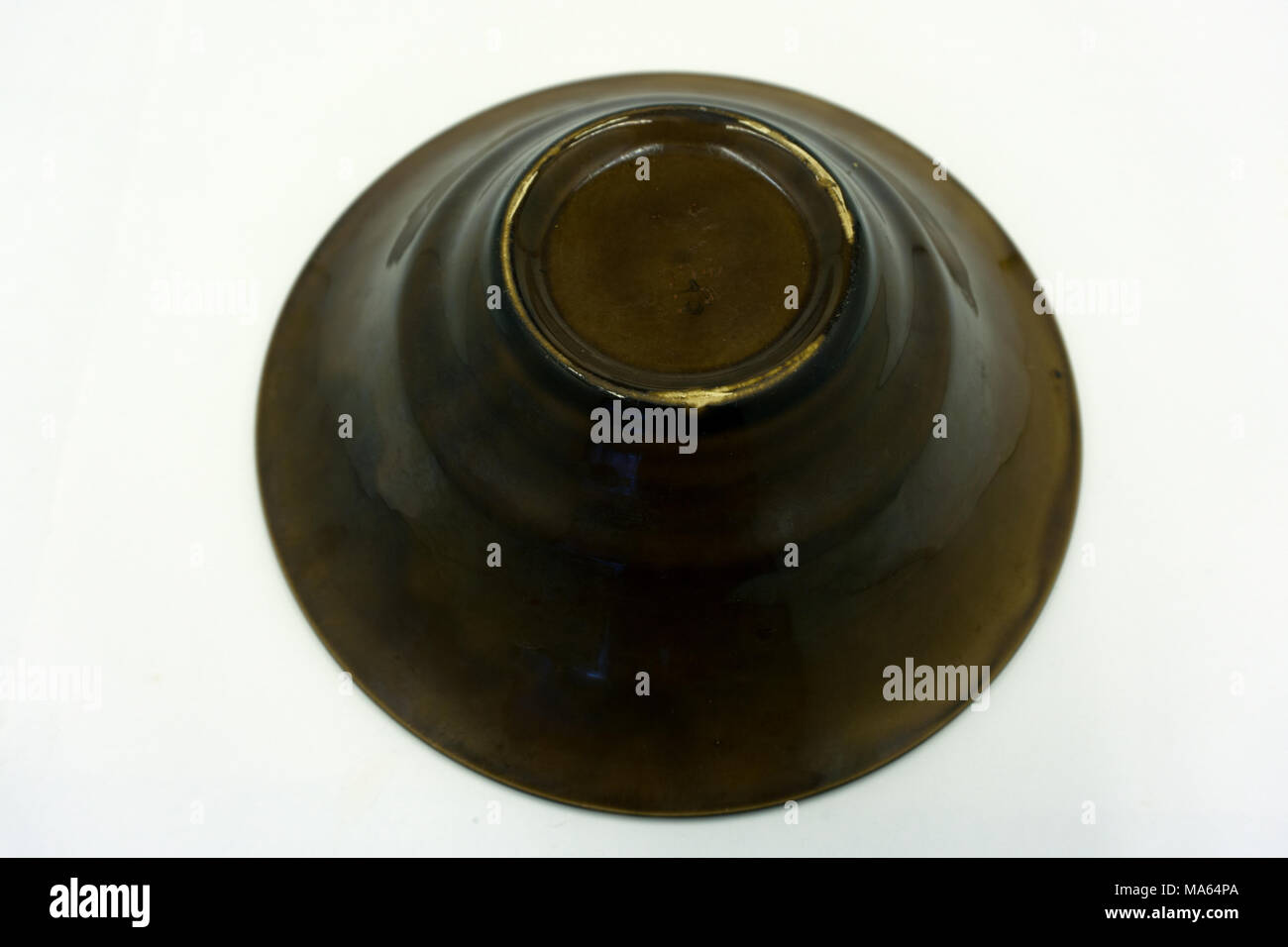 Empty black soup plate on dark grey background, top view Stock Photo
