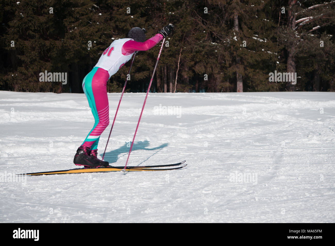 Sportsman in classic style cross country skiing race, competitors
