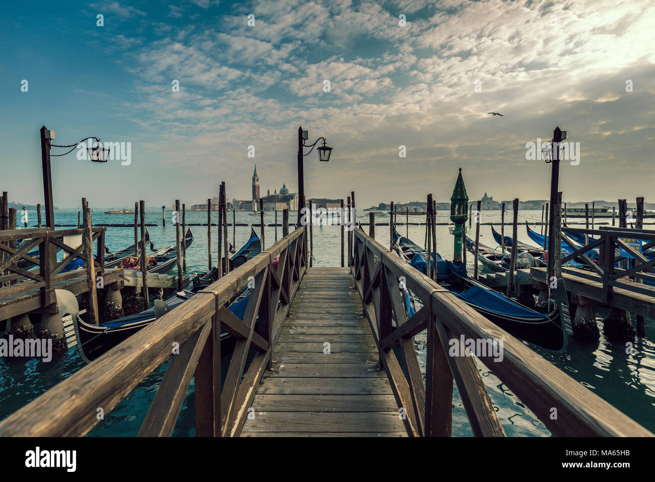 Venice (Italy) - Pier with gondolas on the Venice Lagoon Stock Photo