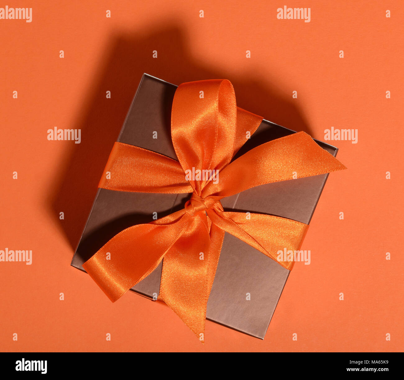 Gift box with tied ribbon bow Stock Photo Alamy