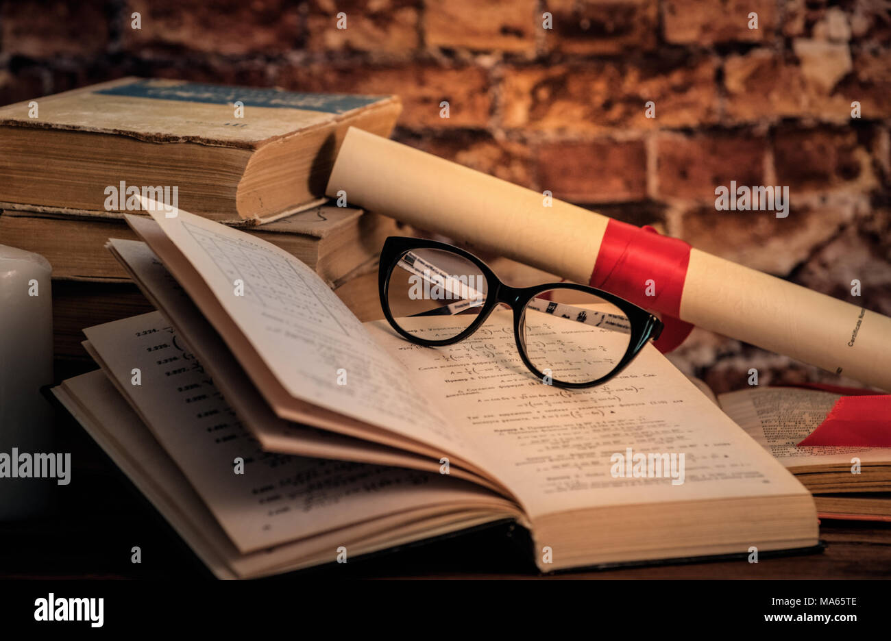 Pile of books, writing-book and pen Stock Photo - Alamy