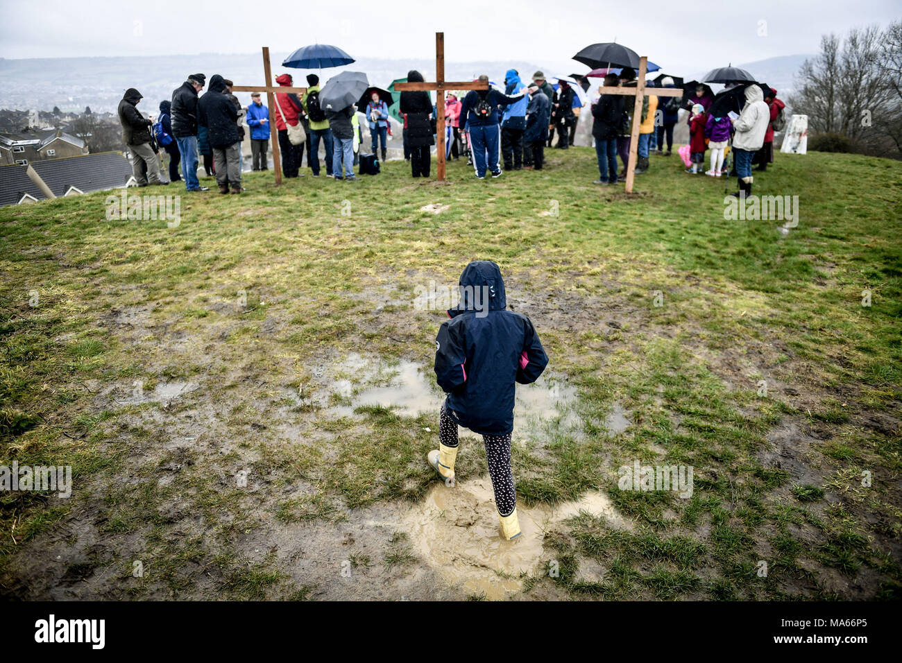 Three wooden crosses are placed on top of Roundhill in Bath, Wiltshire, where several Christian Church congregations attend a hill-top service after taking part in the Walk of Witness to imitate the journey that Jesus took carrying his cross through the streets of Jerusalem on Good Friday. Stock Photo