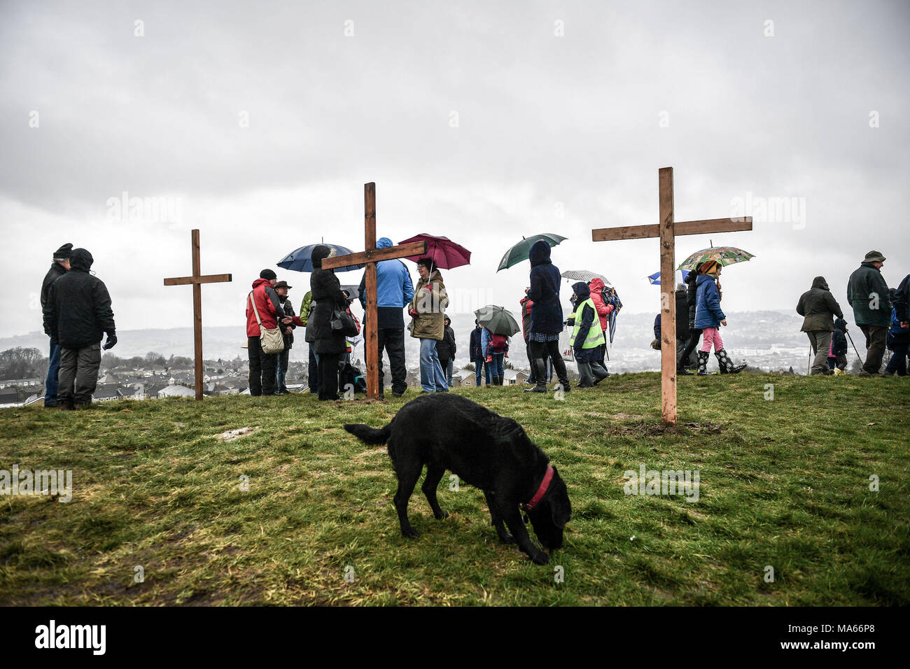Three wooden crosses are placed on top of Roundhill in Bath, Wiltshire, where several Christian Church congregations attend a hill-top service after taking part in the Walk of Witness to imitate the journey that Jesus took carrying his cross through the streets of Jerusalem on Good Friday. Stock Photo