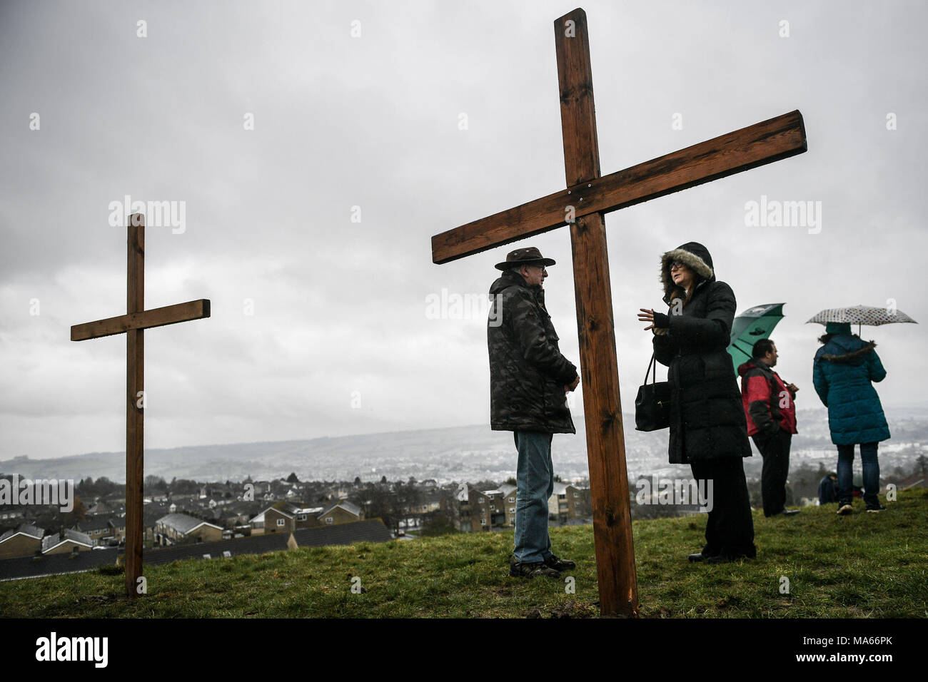 Wooden crosses are placed on top of Roundhill in Bath, Wiltshire, where several Christian Church congregations attend a hill-top service after taking part in the Walk of Witness to imitate the journey that Jesus took carrying his cross through the streets of Jerusalem on Good Friday. Stock Photo
