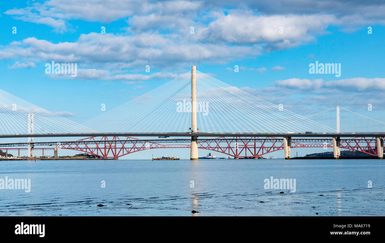 Daytime view of the three major bridges crossing the Firth of Forth at South Queensferry; Queensferry Crossing, North Road Bridge and the Forth Bridge Stock Photo