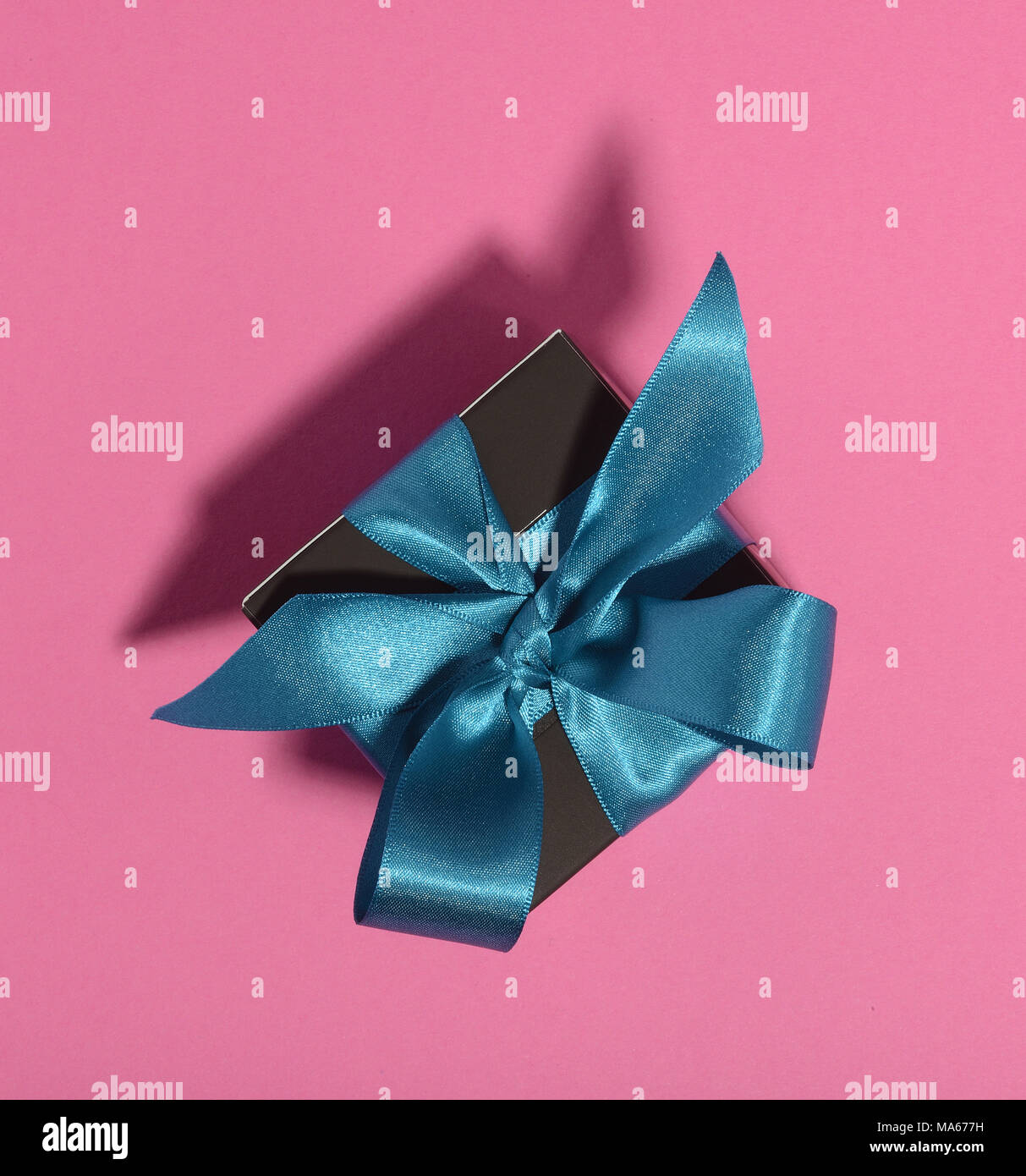 Gift box with tied ribbon bow Stock Photo Alamy