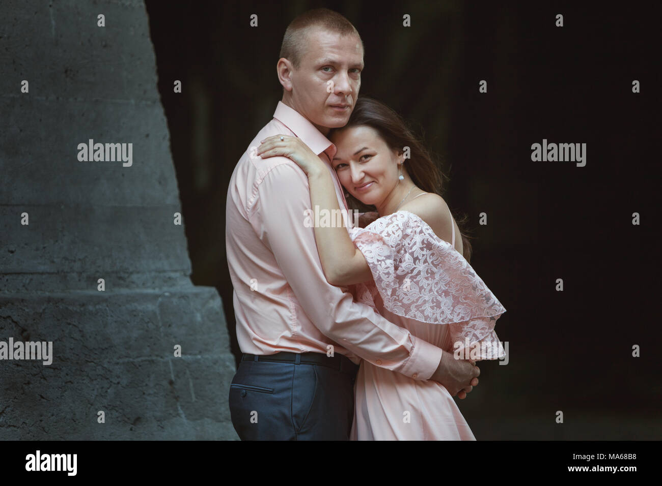 Beautiful young couple. Young woman pressed herself against the man. Stock Photo