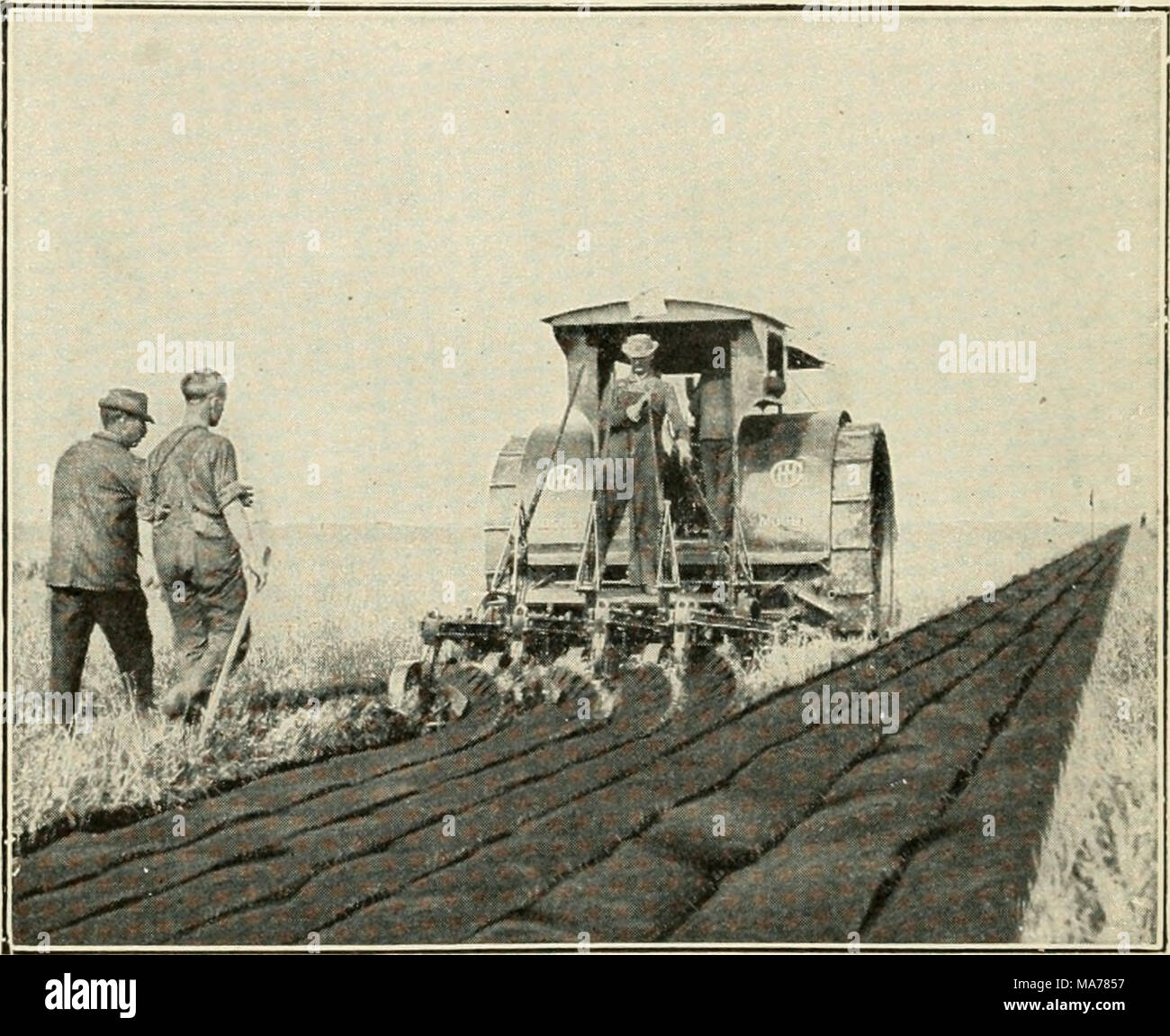 . Elementary agriculture . Fig. 58. A tractor engine drawing four plows