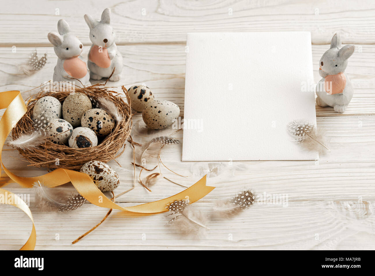 Easter background with Easter eggs and spring flowers. Top view with ...