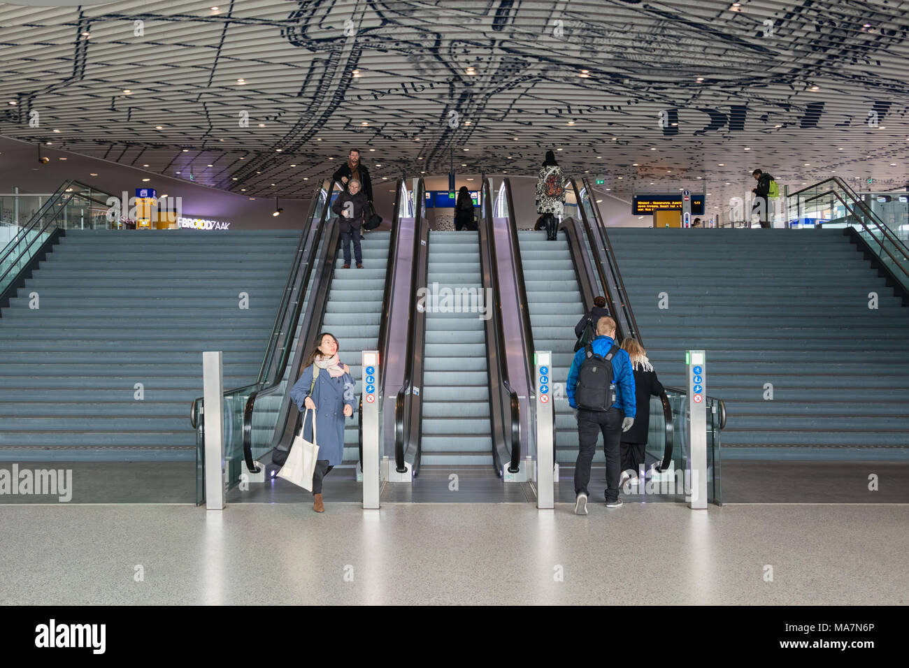 Concourse of new railway station Delft with travellers at escalator Stock Photo