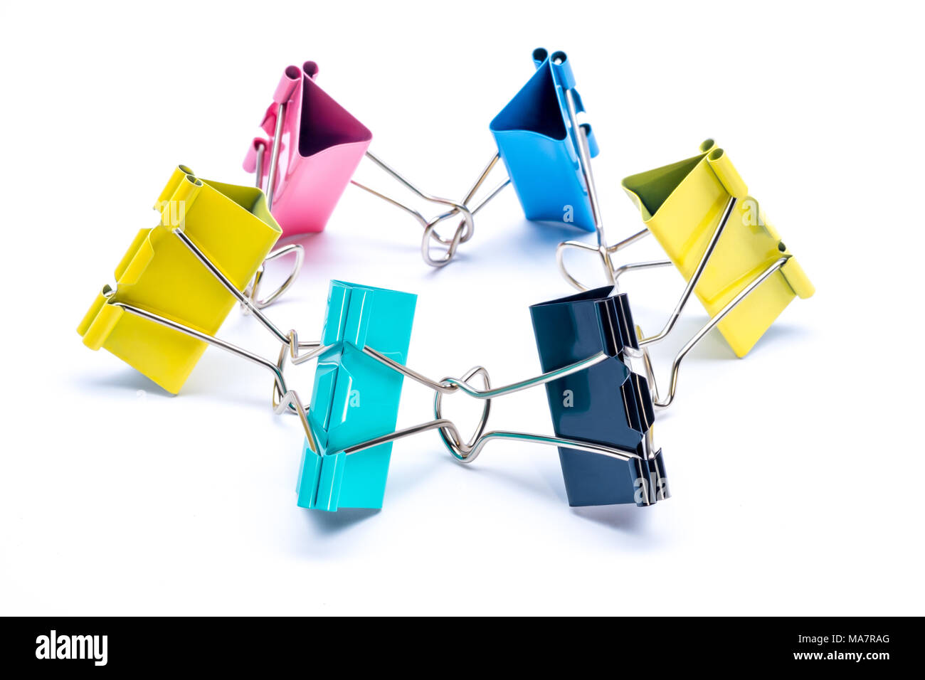 Creative stationery composition. Binder clips on white background. Office and school supply. Stock Photo