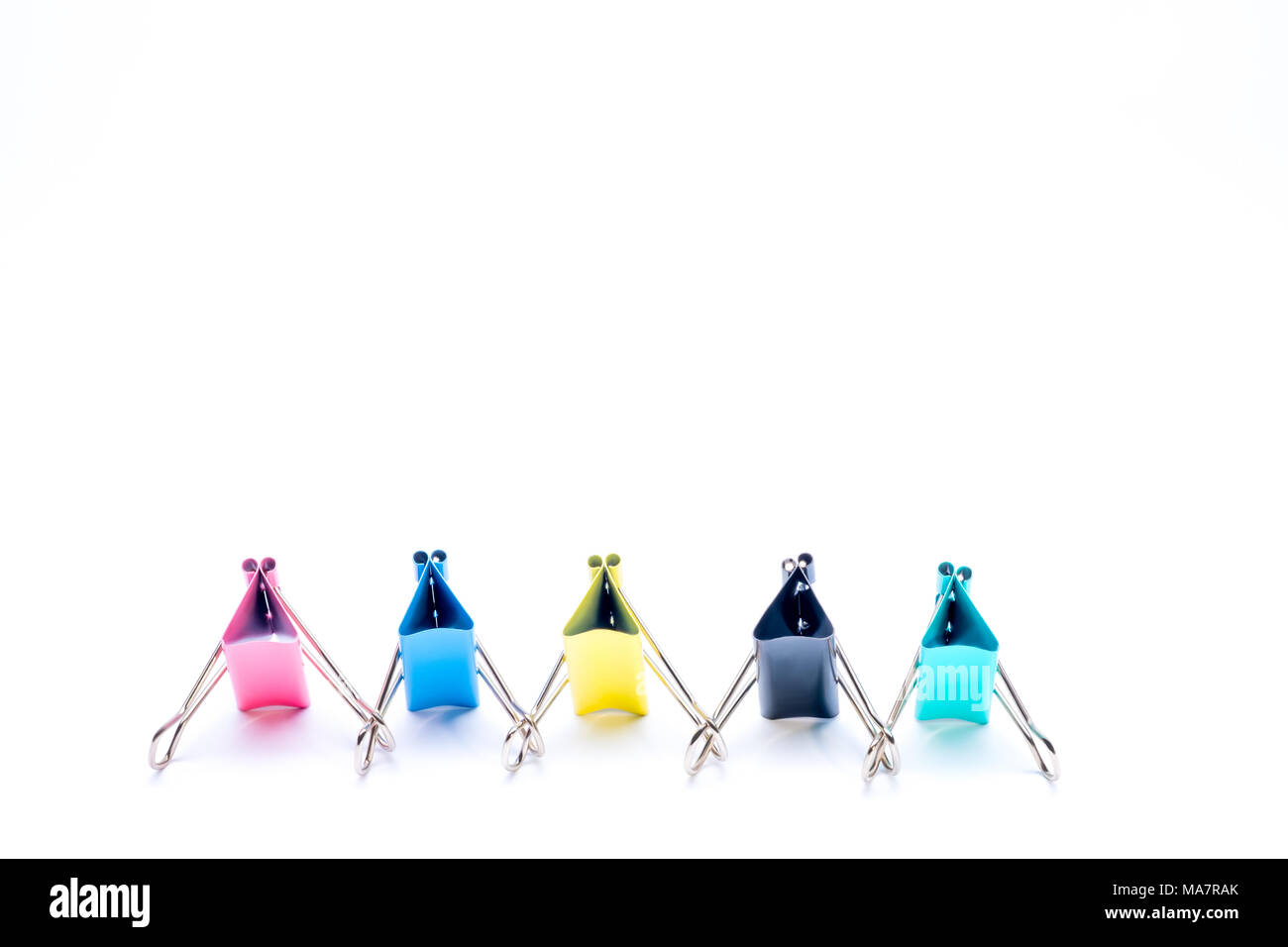 Creative stationery composition. Binder clips on white background. Office and school supply. Stock Photo