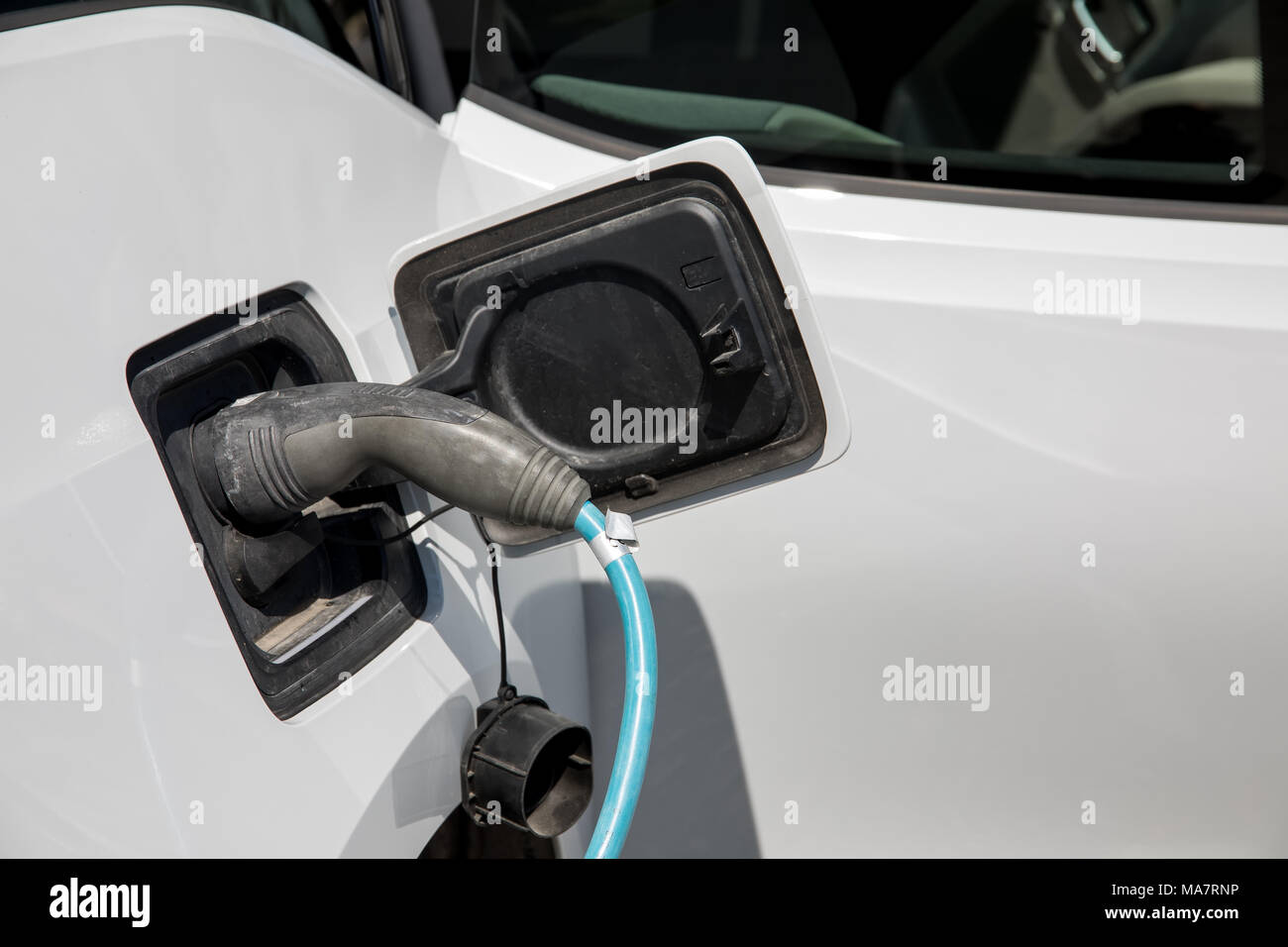Electric car refuel with power Stock Photo Alamy