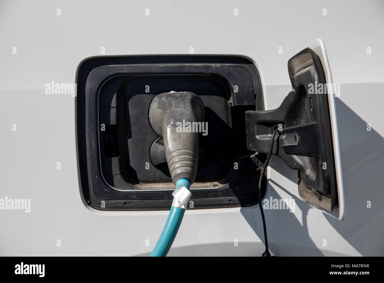 Electric car refuel with power Stock Photo