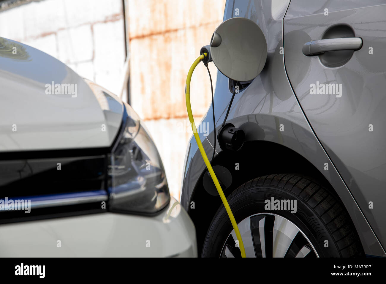 Electric car refuel with power Stock Photo Alamy