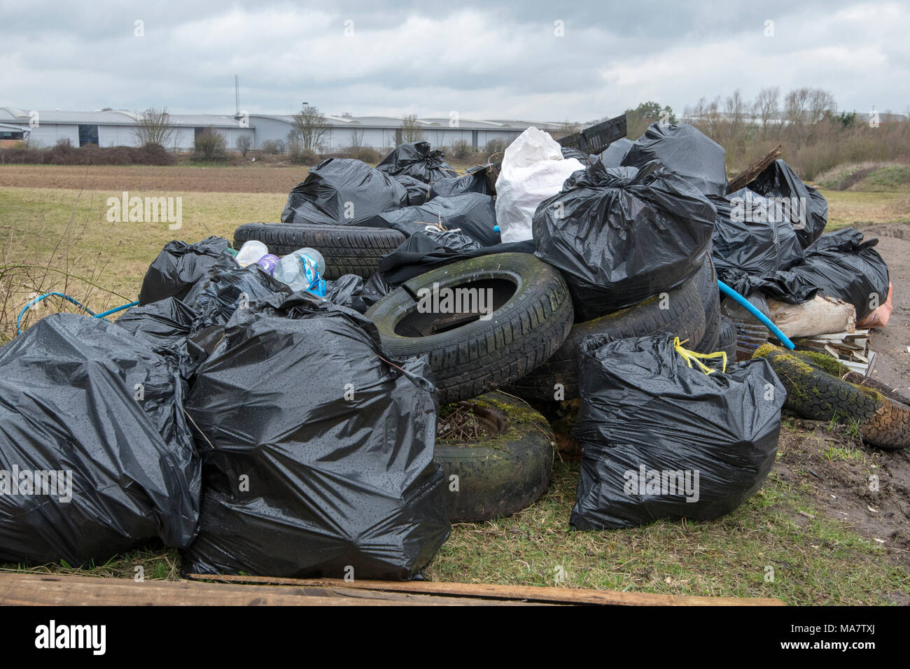 Fly Tipping along the roadside in the village of Snailwell, Newmarket, Suffolk. Friday 30th March 2018 Stock Photo