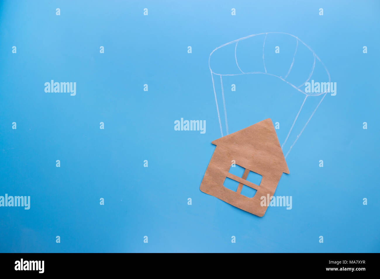 Real estate concept. house on a parachute Stock Photo Alamy