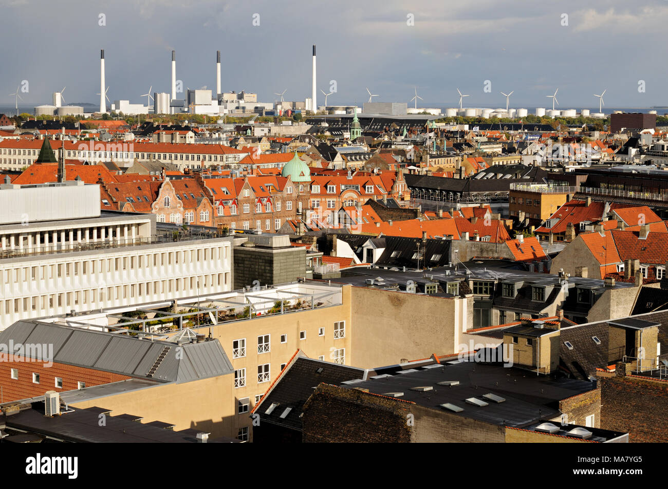 Roofs, chimneys and wind turbines from Rundetaarn, Copenhagen, Denmark Stock Photo