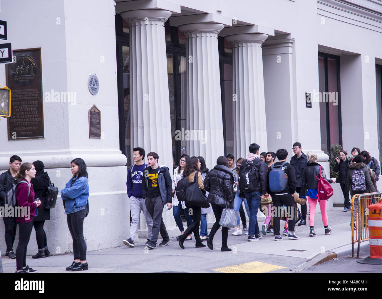 NY University students changing classes on the street at Waverly Pl