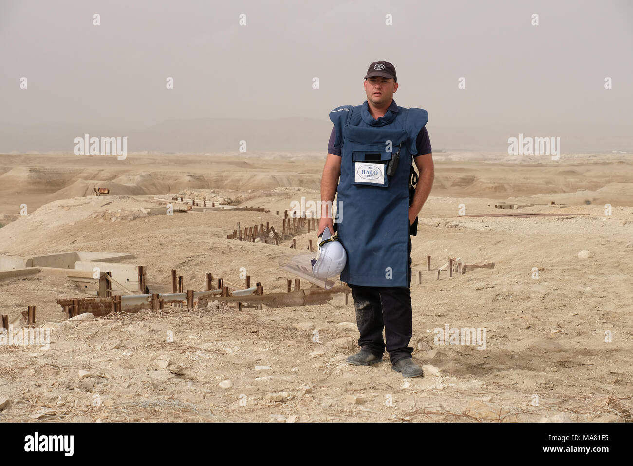 Qaser el Yahud, Israel 29th March 2018. Operations and Logistics Officer of HALO Trust group Hagai Golibrozky stands over a deserted military position in 'The land of Monasteries' area near the baptismal site Qaser el Yahud traditional site of the baptism of Jesus by John the Baptist in the Jordan River Valley region of West Bank, Israel. The area started to be cleared of some 4,000 landmines from the 1967 war and its aftermath by HALO Trust, a Scottish demining group that operates in 19 places around the world. Stock Photo