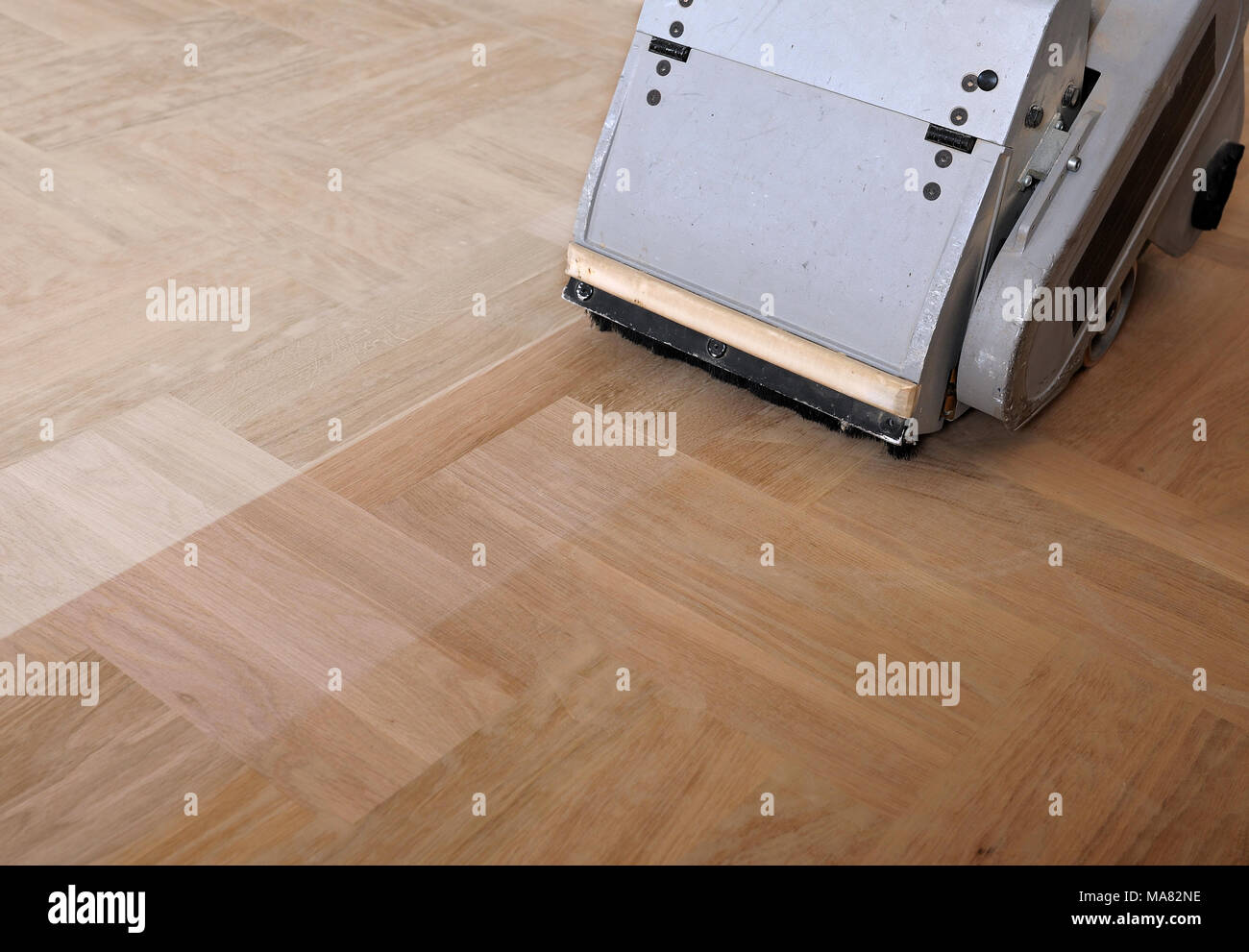 Sanding Hardwood Floor With The Grinding Machine Repair In The