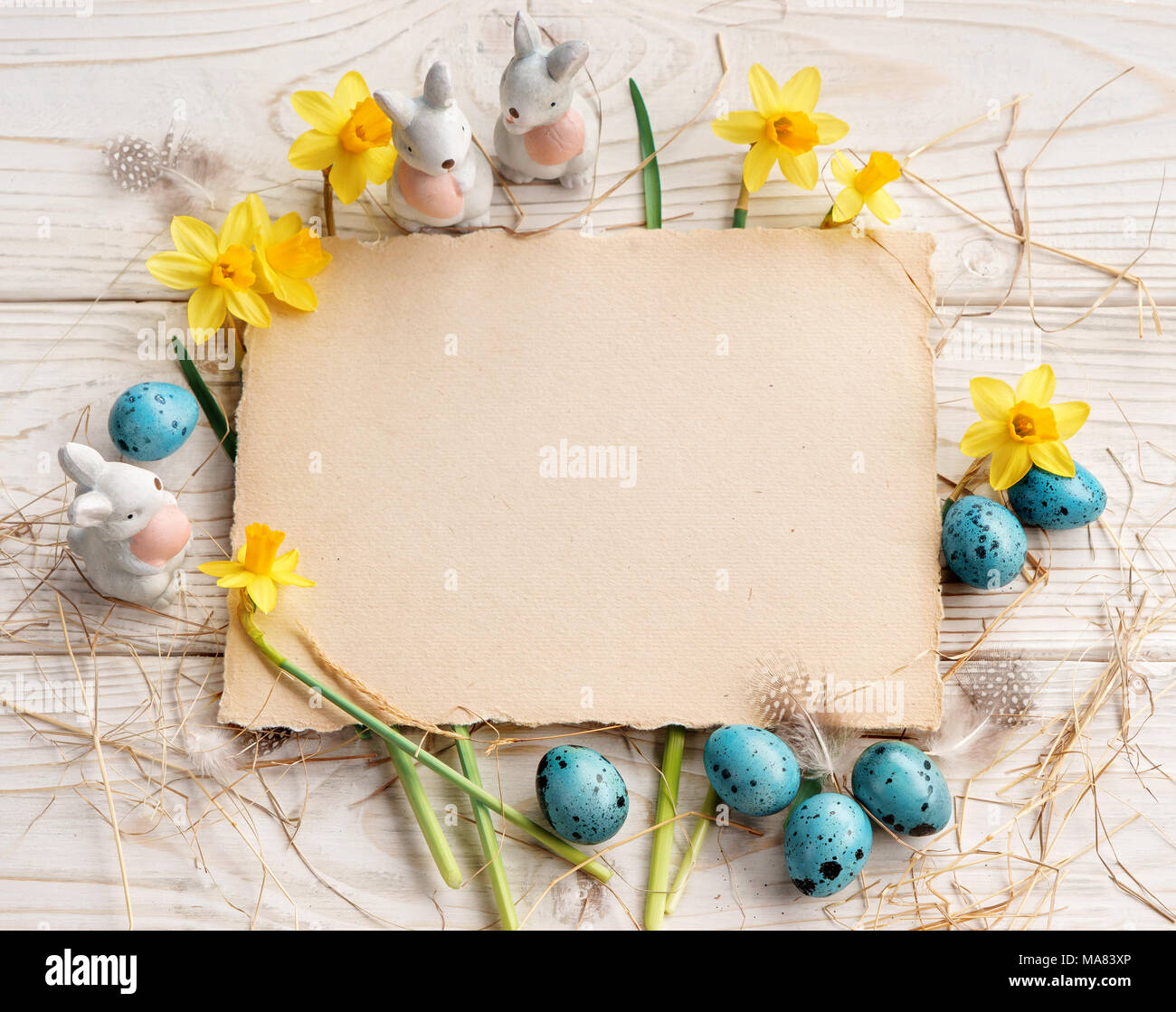Easter background with Easter eggs and spring flowers. Top view with ...