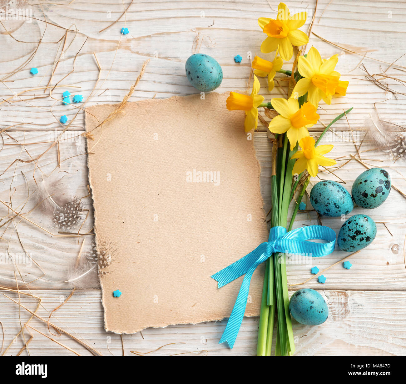 Easter background with Easter eggs and spring flowers. Top view with ...