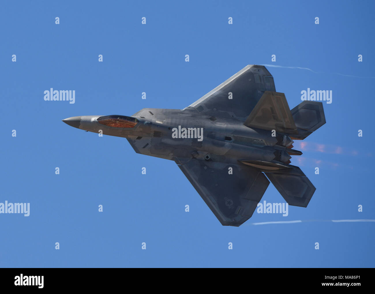 An F-22 Raptor flies a performance demonstration during the 2018 Los Angeles Air Show in Lancaster, Calif., March 23, 2018. The combination of stealth, super cruise, maneuverability, and integrated avionics, coupled with improved supportability allows the Raptor to perform a wide-range of aerial feats. (U.S. Air Force photo by Senior Airman Kaylee Dubois) Stock Photo