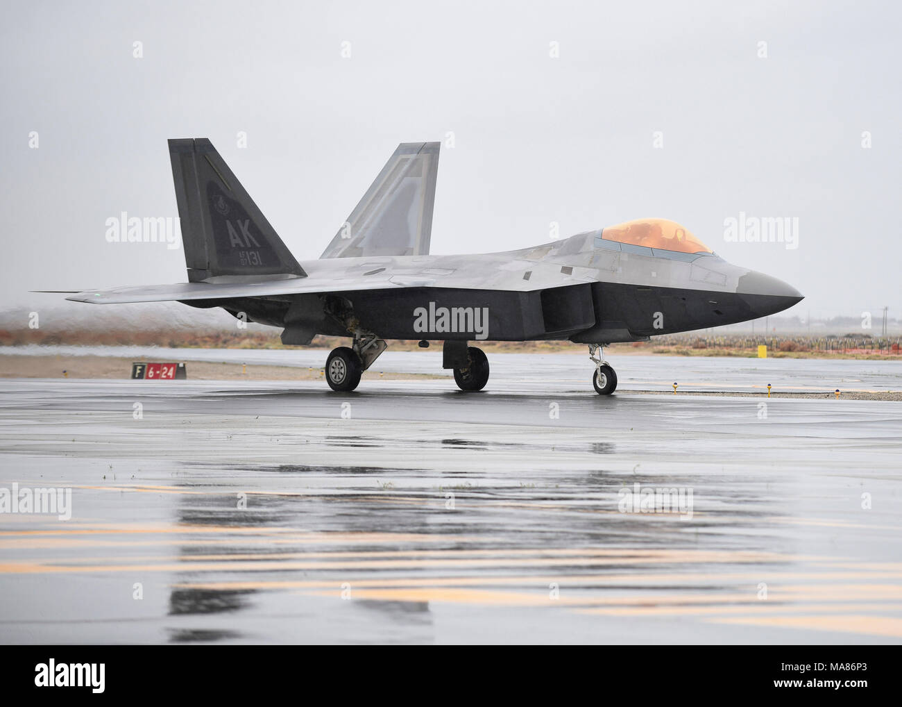 A U.S. Air Force F-22 Raptor taxis after landing at General William J. Fox Airfield in Lancaster, Calif., March 22, 2018. The F-22 is the main performer this year for the Los Angeles County Airshow held at the airfield. (U.S. Air Force photo by Senior Airman Kaylee Dubois) Stock Photo