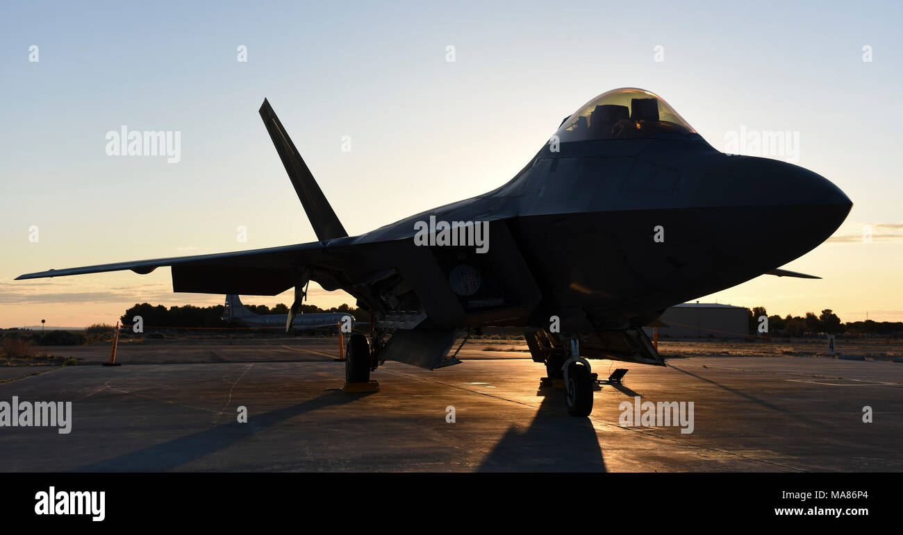 An F-22 Raptor awaits take-off after the 2018 Los Angeles County Air Show in Lancaster, Calif., March 26, 2018. The  F-22 Raptors were flown in from Joint Base Elmendorf–Richardson, Alaska, to ensure mission operations continue throughout the Air Combat Command. (U.S. Air Force photo by Senior Airman Kaylee Dubois) Stock Photo