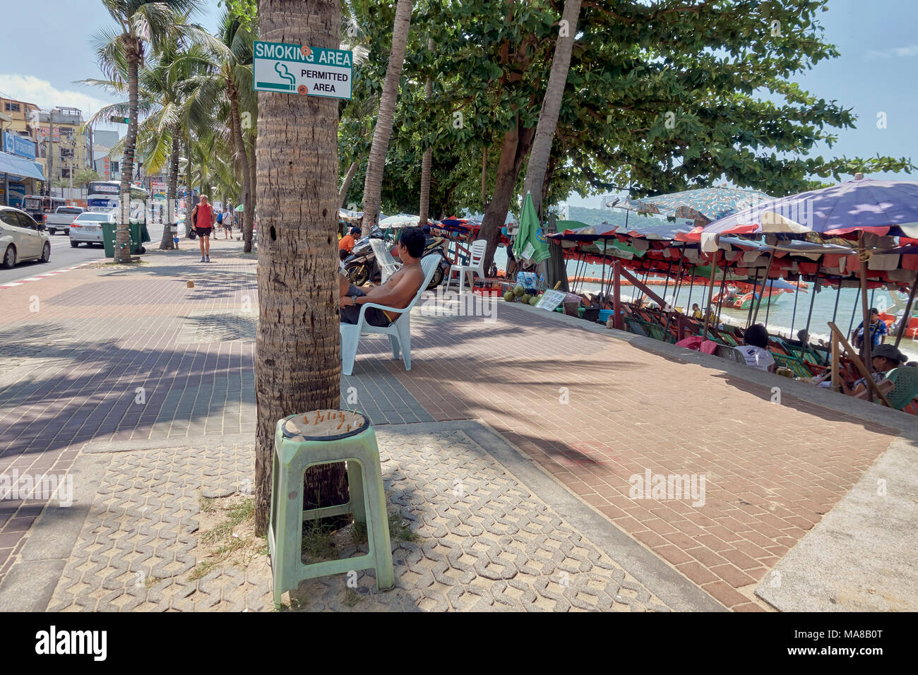 Smoking area on Pattaya Beach Road. Thailand beach smoking ban Stock Photo