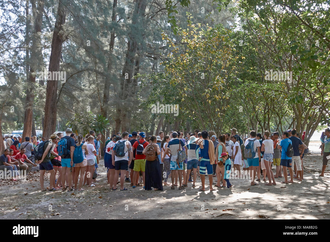 Thailand tourism. Crowd of tourists at Ao Nang beach Krabi Thailand awaiting boat trip Stock Photo