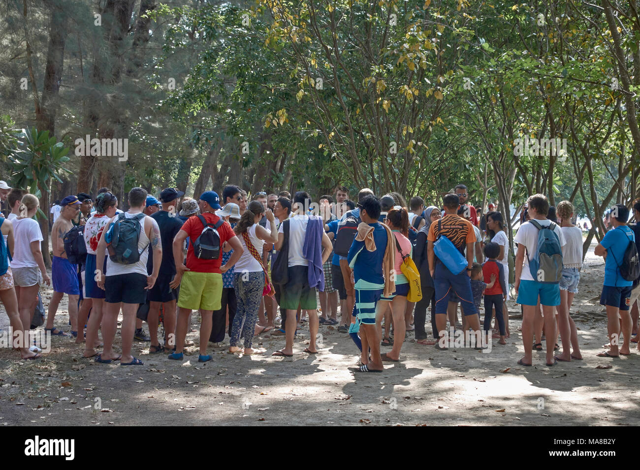Thailand tourism. Crowd of tourists at Ao Nang beach Krabi Thailand awaiting boat trip Stock Photo