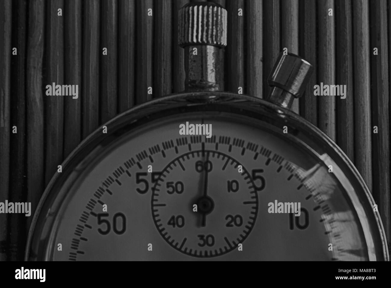 Vintage antiques Stopwatch, retro on wooden background, value measure