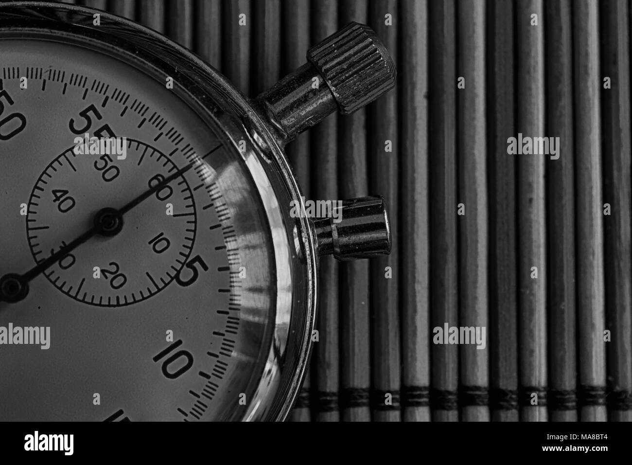 Vintage antiques Stopwatch, retro on wooden background, value measure