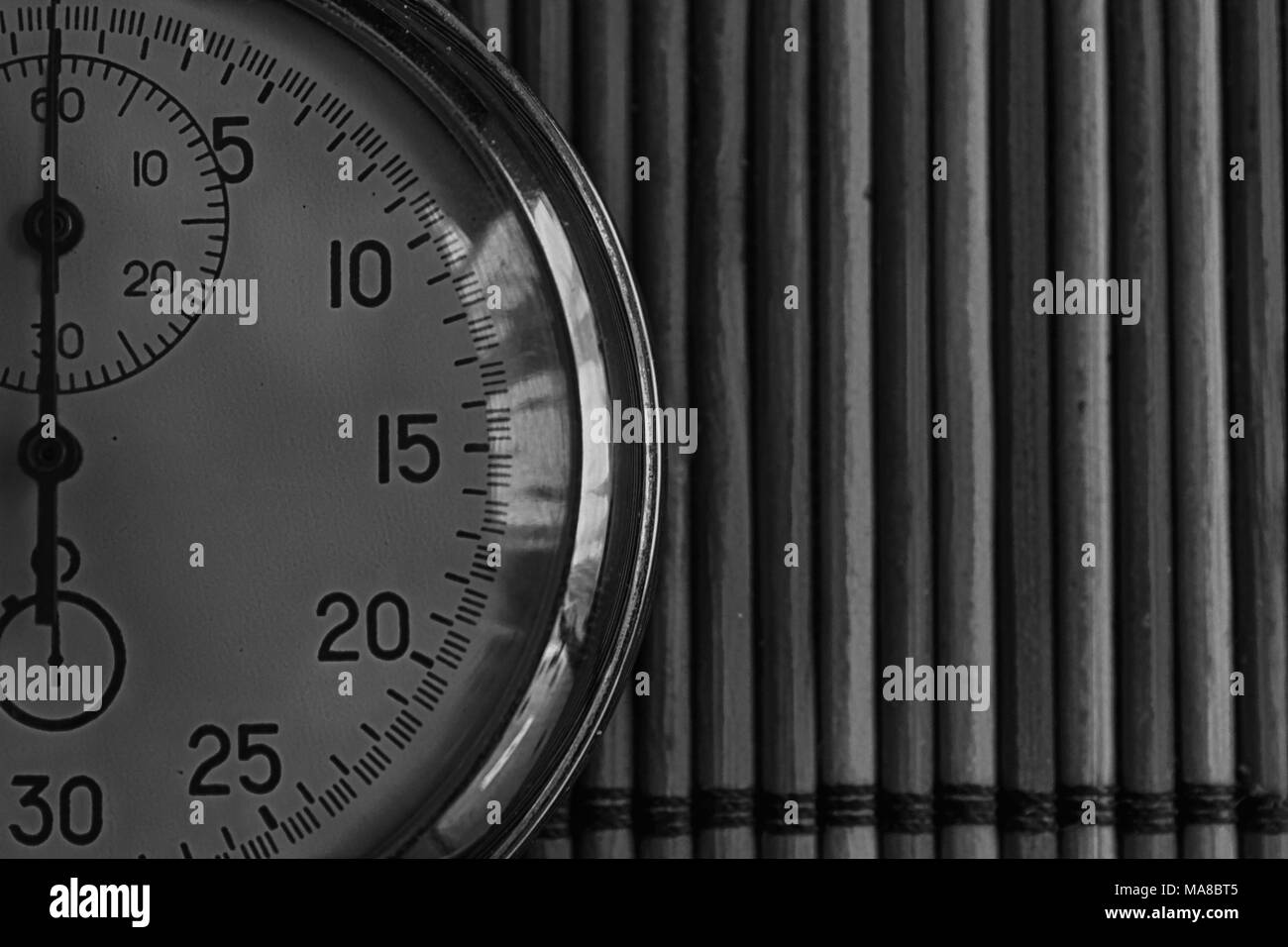 Vintage antiques Stopwatch, retro on wooden background, value measure time old clock arrow minute second accuracy timer record. Stock Photo