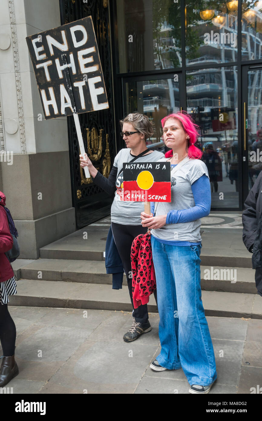 Women with 'End the Hate' and 'Australia is a Crimes Scene' placards at Australia House, London demanding an end to forced closure of Aborigine Communities. Stock Photo