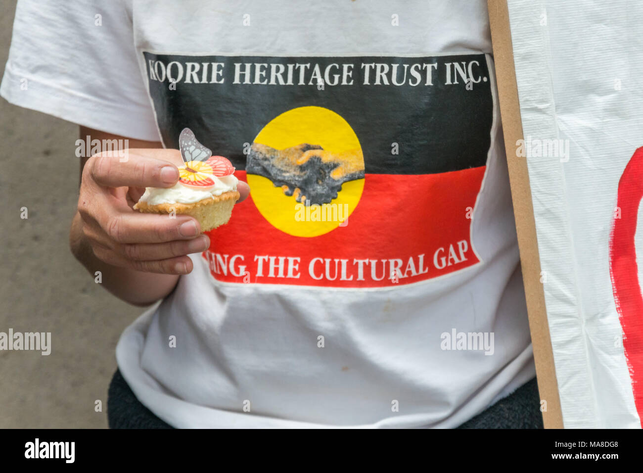 Cakes for the protest against closure of Aborigine communities, with butterflies in the colours of the Aborigine flag - black for the people, red for the earth of their land and the yellow disc of the sun which gives life and protects it. Stock Photo