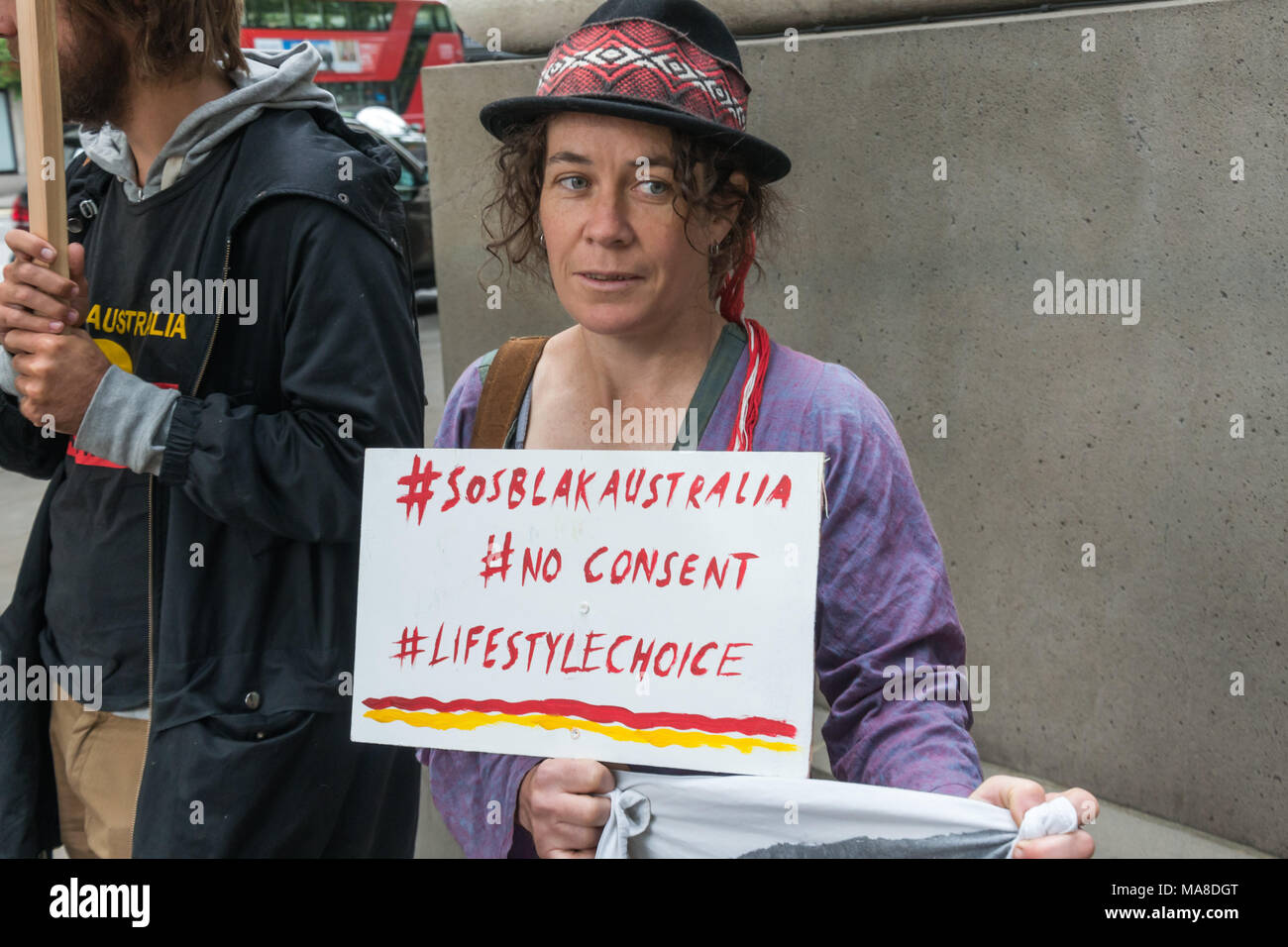 A placard with 3 hashtags at the protest at Australia House, London demanding an end to forced closure of Aborigine Communities, #sosblakaustralia, #noconsent and #lifestylechoice, a reference to the dismissal of their rights by PM Tony Abbott. Stock Photo