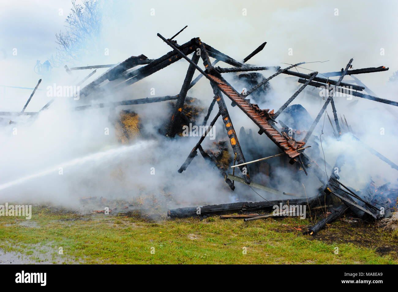 fire brigade in action at burning farm house in Bavaria, Germany, Stock Photo