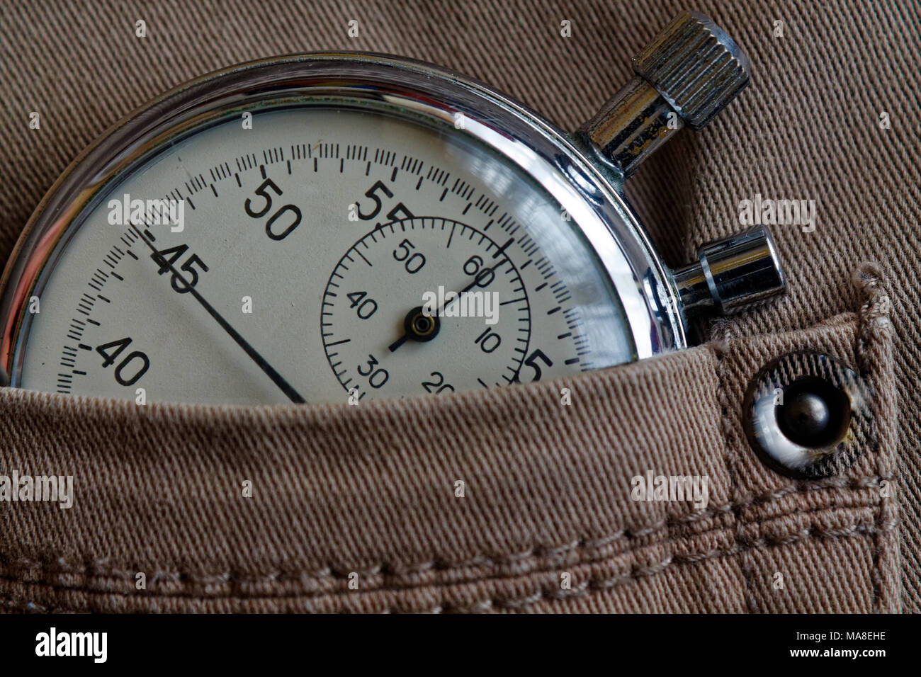 Vintage antiques Stopwatch, in old beige denim pocket, value measure