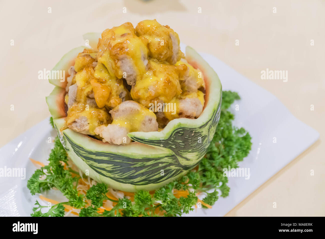 Fried chicken in watermelon Carving swan. Stock Photo